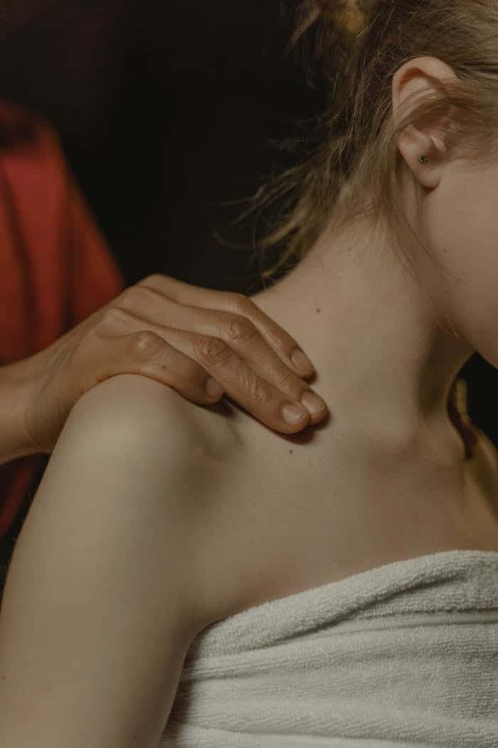 A calming shoulder massage for wellness and relaxation indoors.